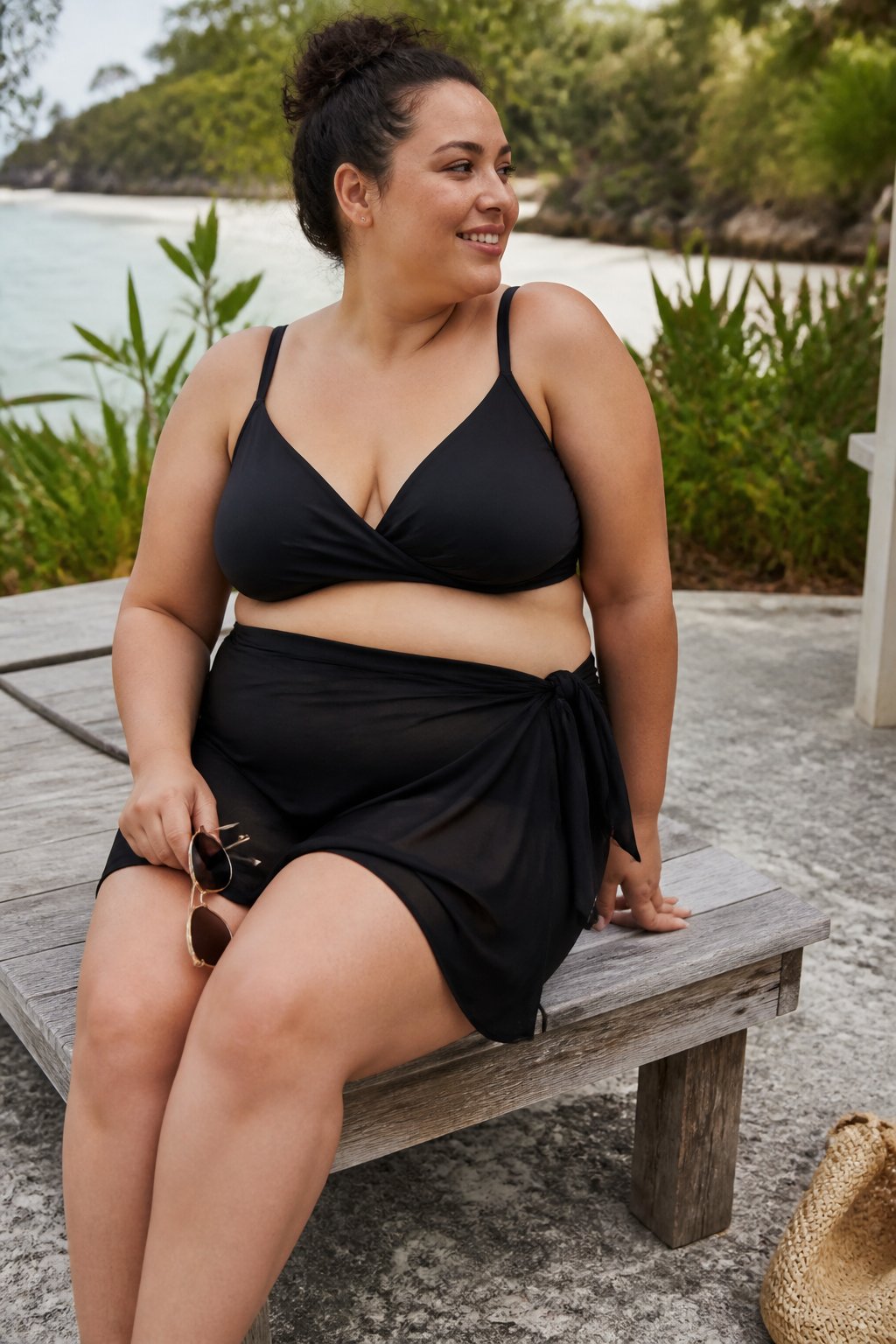 A plus size woman wearing a swim wrap skirt outdoors near water, casually posed with natural daylight and soft shadows.
